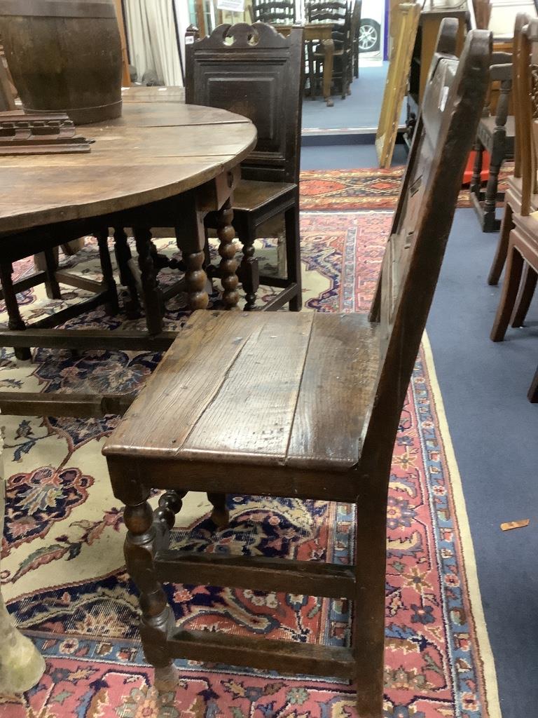 A 17th century oak back stool with lozenge carved decoration, width 47cm, depth 39cm, height 98cm